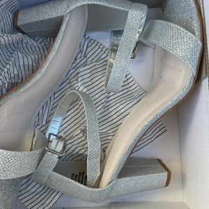 Brand new. Silver sparkle heels